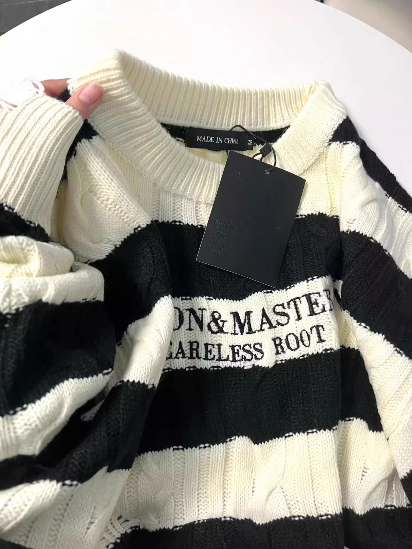 trendy black and white striped knitted sweater